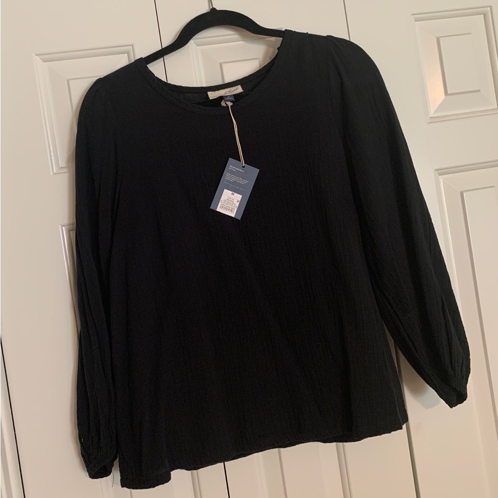 Gauze 3/4 length sleeved top. Great transition piece for Fall!
